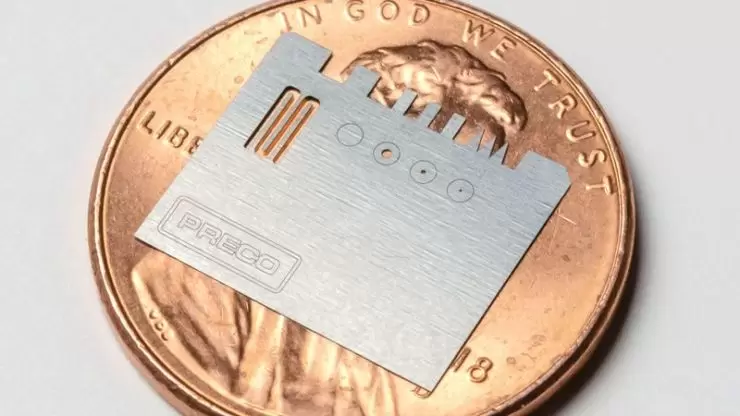 Ultrafast laser processing metal sample on penny