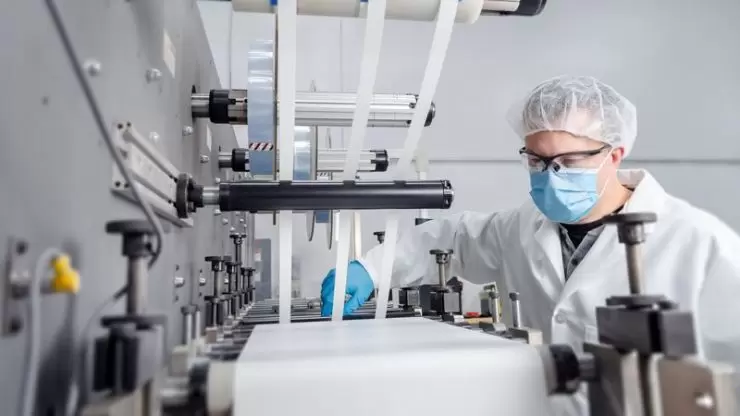 Contract manufacturing medical material on a rotary die cutting machine
